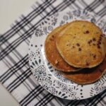 chocolate chip pancakes stacked on a plate