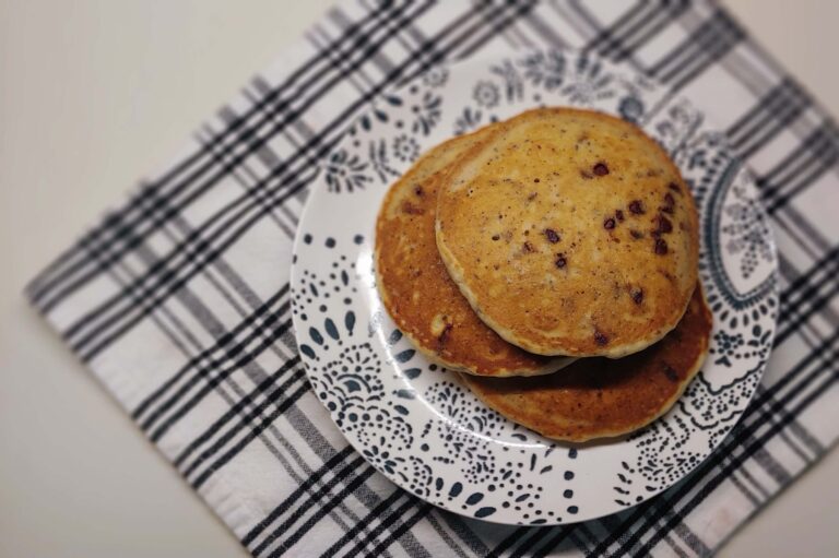 chocolate chip pancakes stacked on a plate