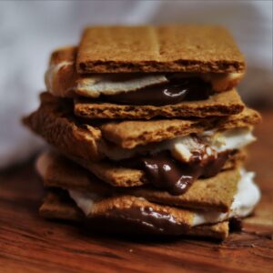 stack of s'mores on a wooden cutting board