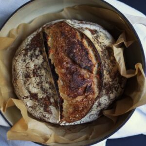 artisan sourdough bread boule in a dutch oven