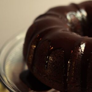 dairy free chocolate ganache on a chocolate bundt cake