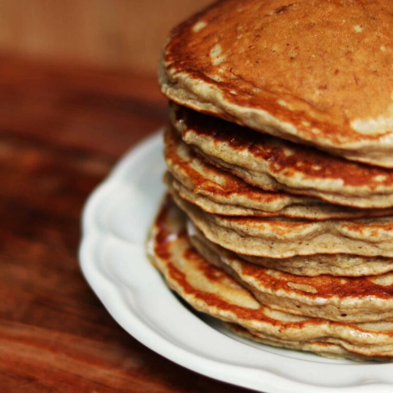 close up of banana pancakes on a plate