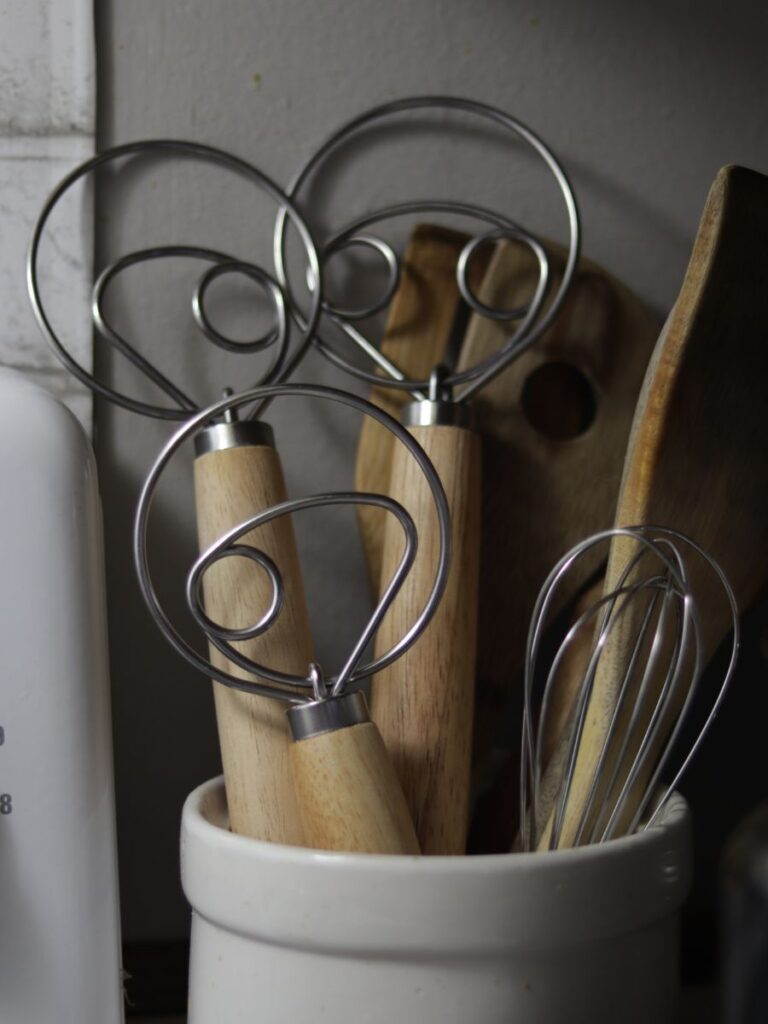 danish dough whisks in a utensil holder