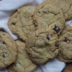 brown butter sourdough discard chocolate chip cookies on a tea towel